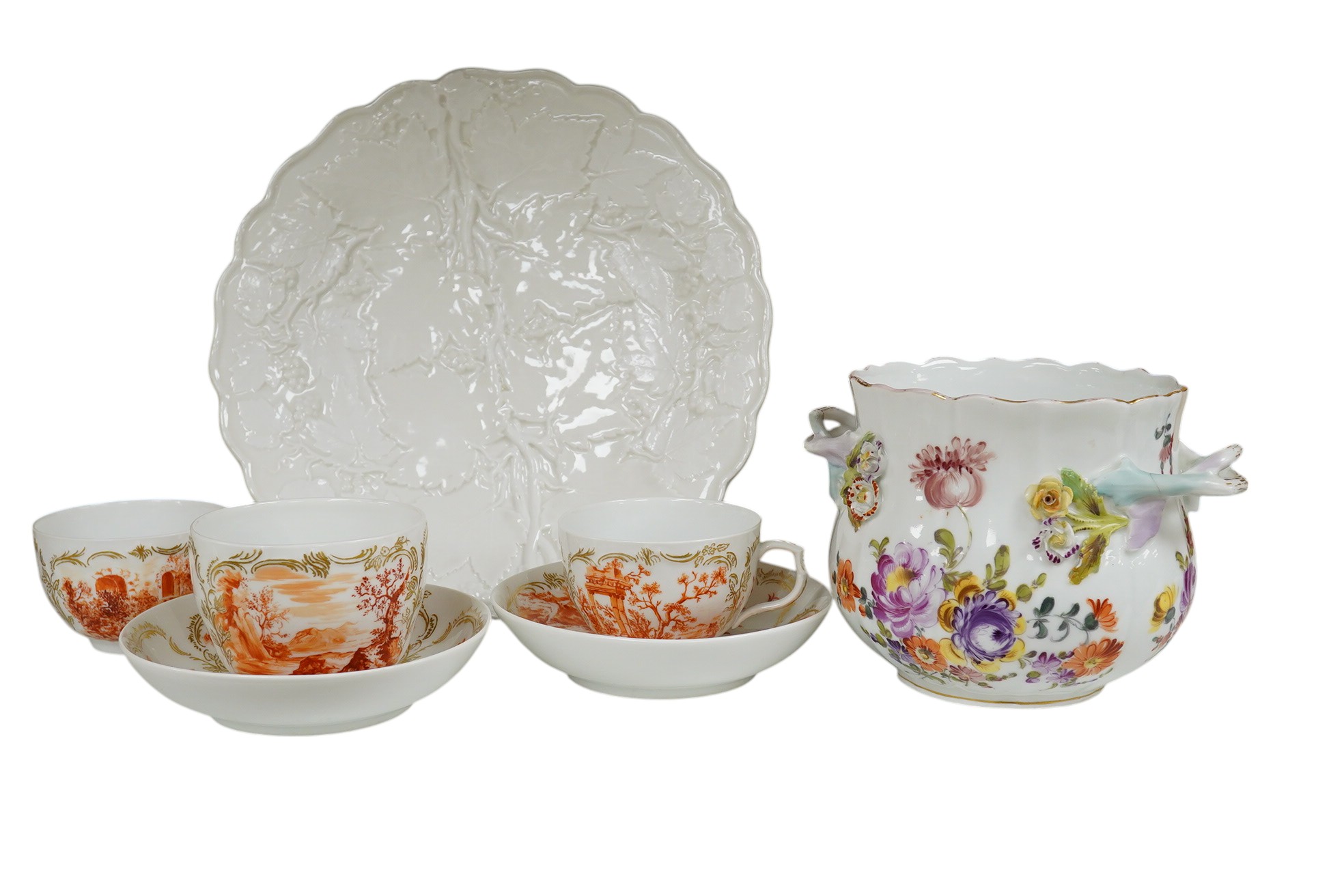 A 19th century Berlin part teaset, painted en camaieu in iron red, a Meissen vineous moulded dish and a Potschappel cache pot, Cache pot 12cm high.